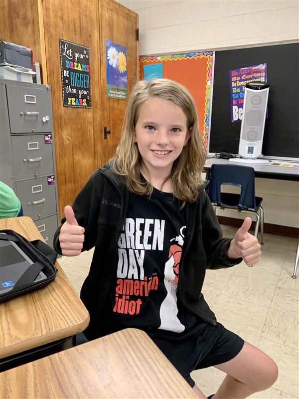 Student in green day shirt